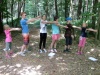 Yolks practising their dance performance in the woods